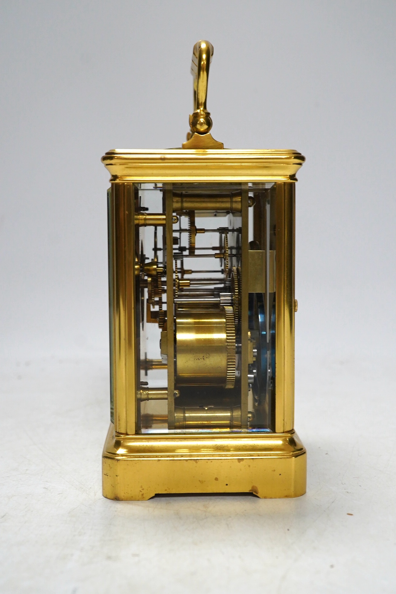 A cased unnamed brass carriage clock, 14cm tall. Condition - fair